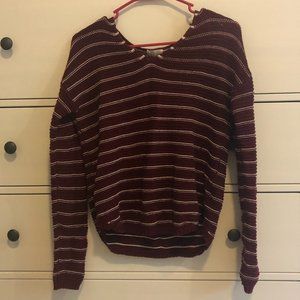 Red sweater with white stripes